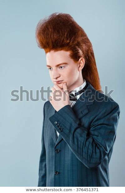 stylish-redheaded-young-man-bouffant-600w-376451371.jpg