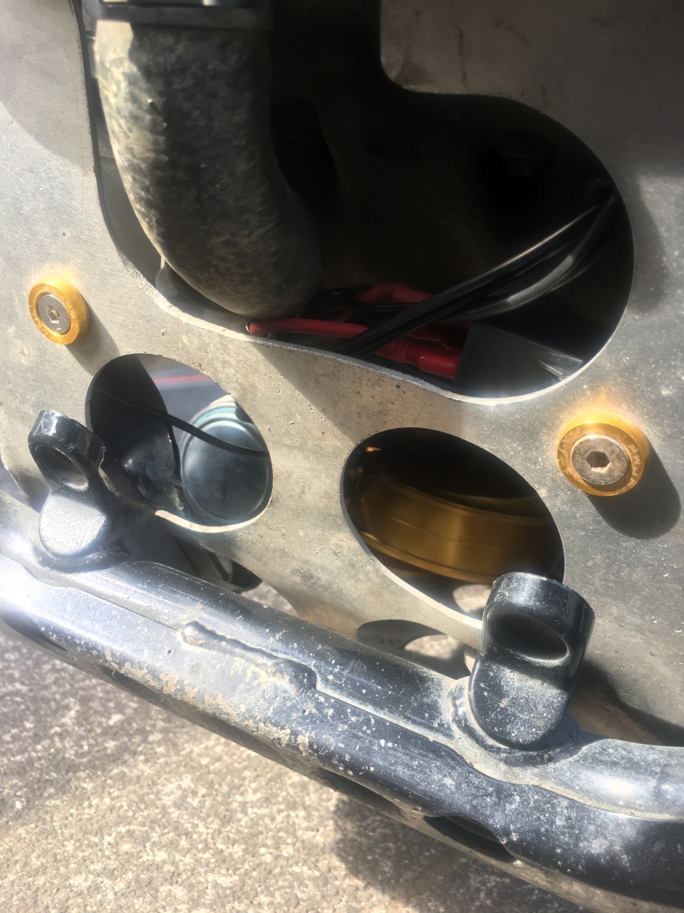 Originally to cover gap from catalytic converter, now horn mount