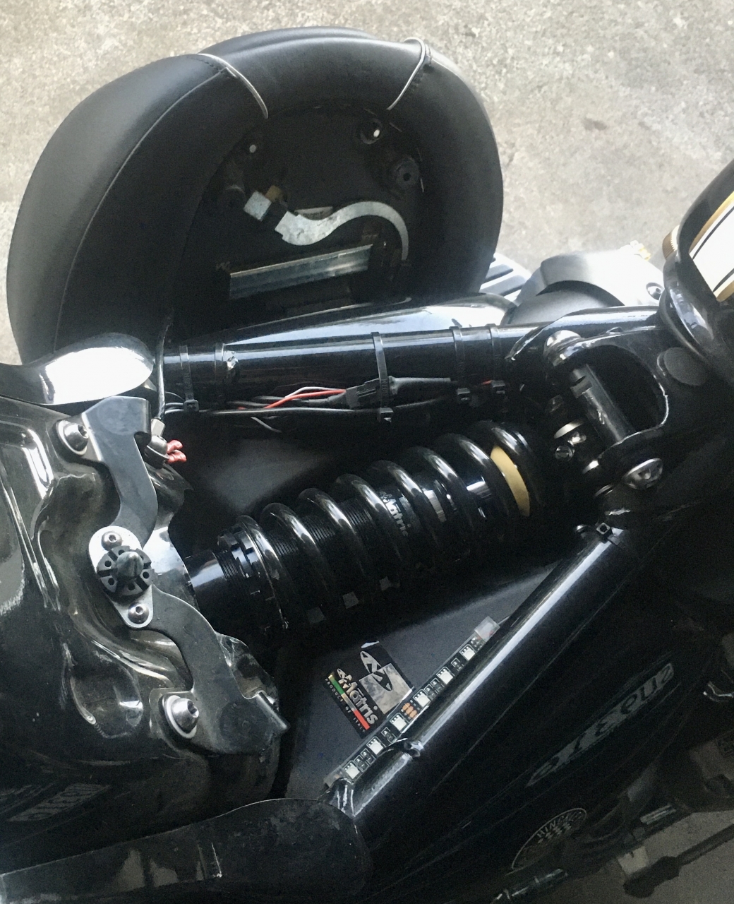 Access to the bolts required removal of side faux carb panels.<br />
Locktite and tighten to...